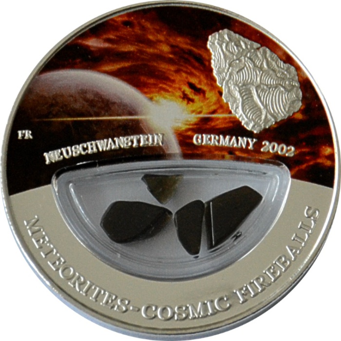 Серебряная монета с фрагментами метеорита