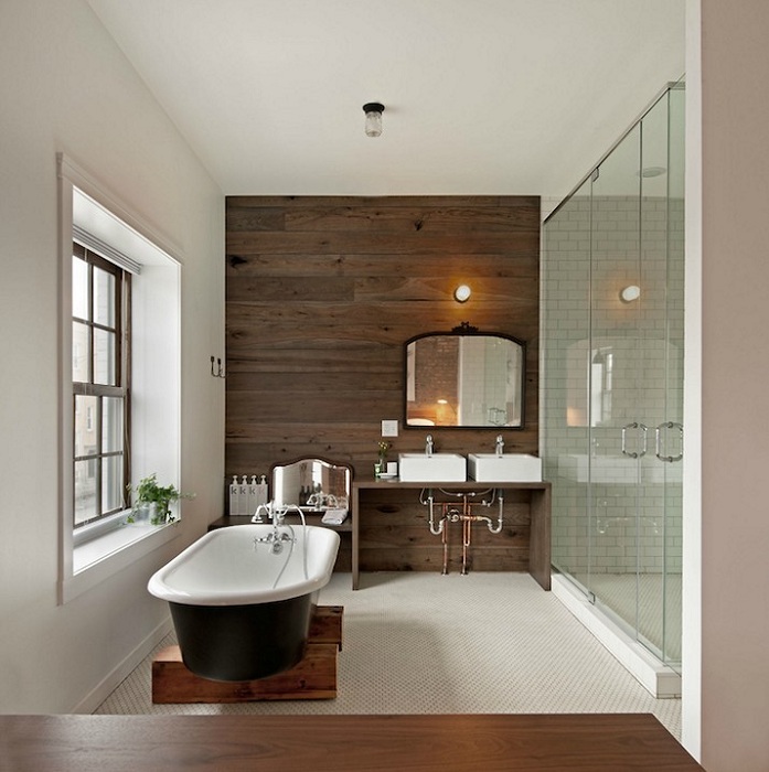 Ванна кімната оформлена в сучасних тенденціях.